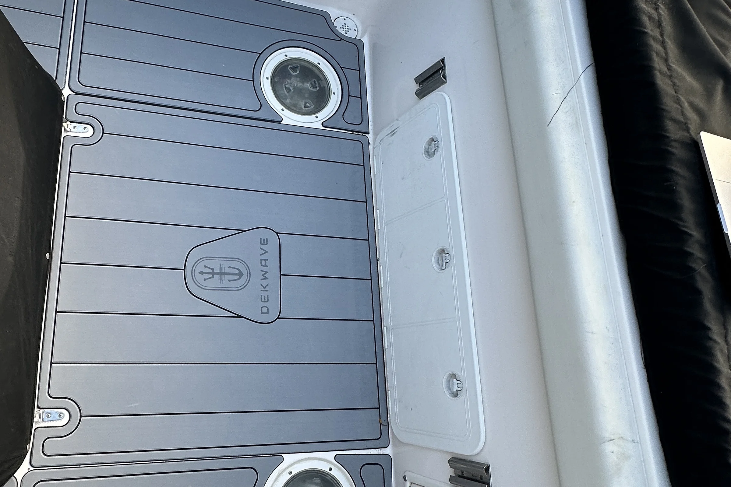 Grey EVA deck fitted around the hatches, with a routed DekWave logo