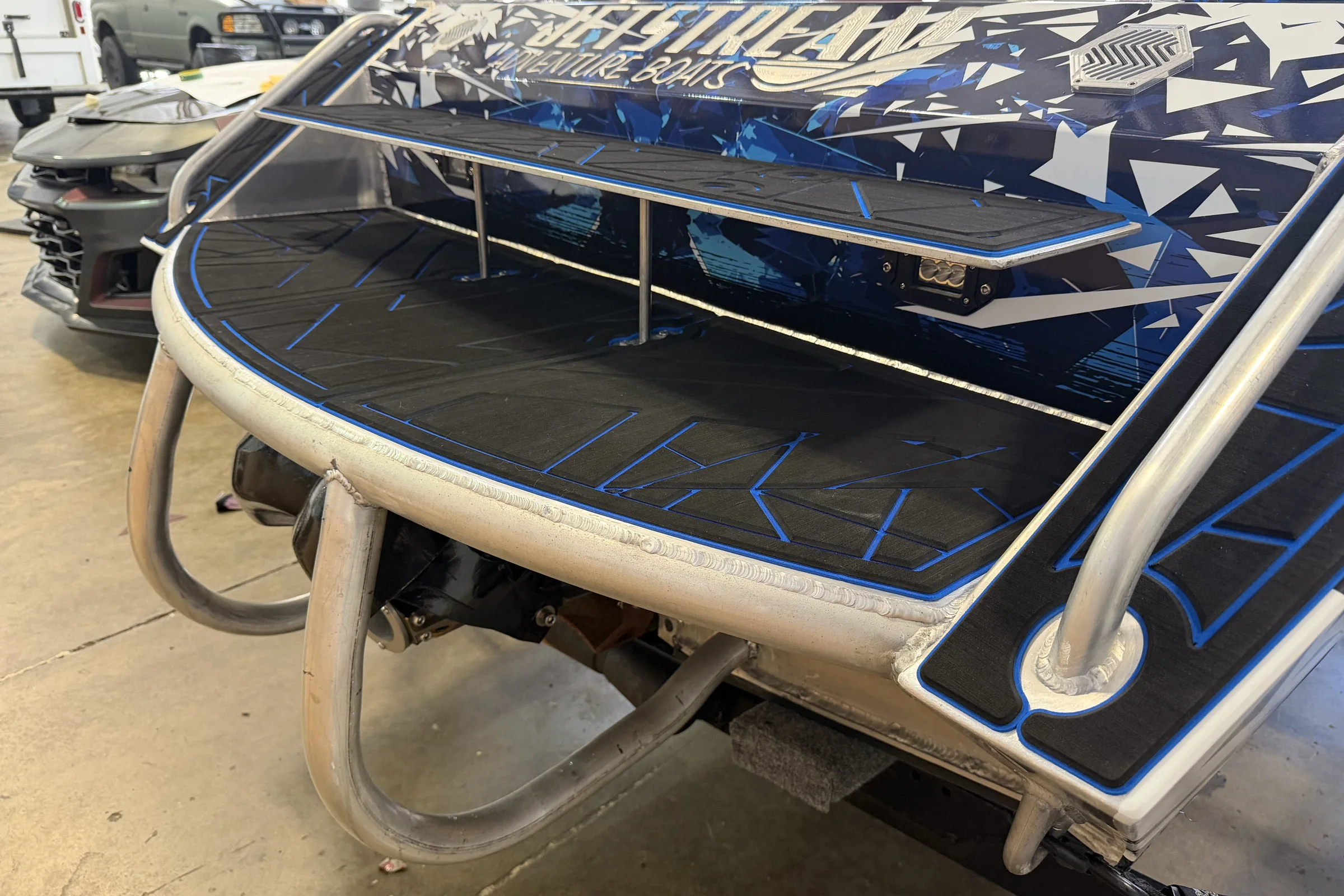 Custom blue and black EVA decking on a jet boat swim platform